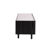 The Taza TV Unit featuring sturdy carbon steel feet and a modern, architectural silhouette perfect for upscale interiors.